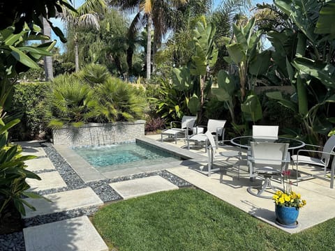 Large spa in private backyard in single family home one mile from the beach.