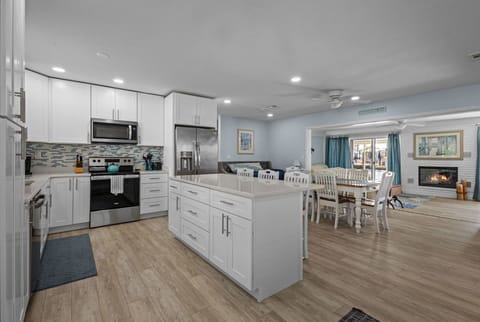 Open floor plan, always be a part of the party, not closed in the kitchen.