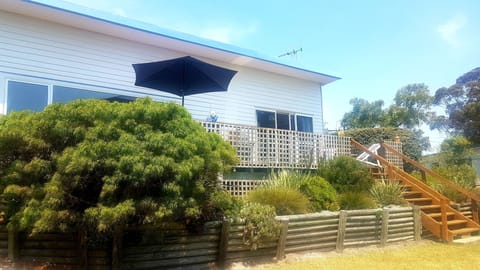 The Beach House overlooking Georges Bay with private path to bayside beach.