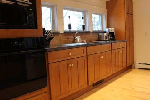 Oven, microwave and smooth electric cooktop.