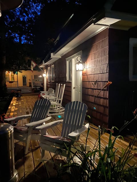 Coach house private deck at night.