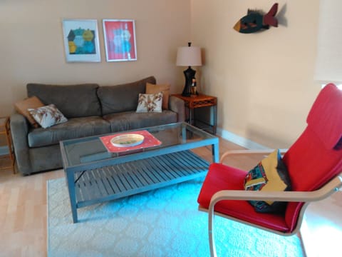 Living room features queen sleeper pull-out & Ikea arm chair