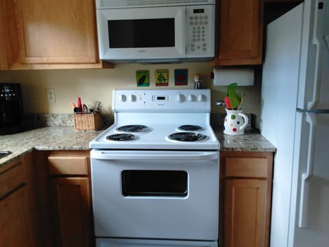 well equipped kitchen includes cuisinart coffee maker, grinder, microwave, d/w