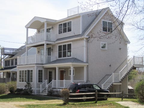 Exterior with three front porches/sunroom