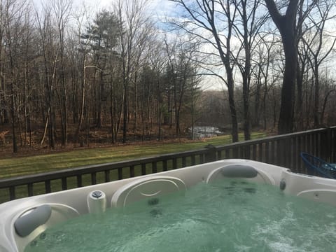 Hot tub on back deck overlooking yard and Kaaterskill Creek