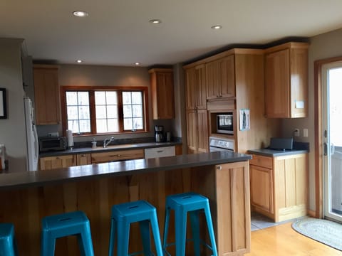 Well-equipped kitchen with bar seating