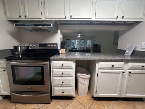 Newly refinished cabinets w undercounter lighting.