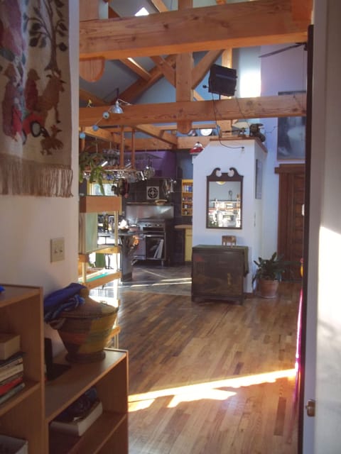 hallway from the master bedroom looking into the living area and kitchen