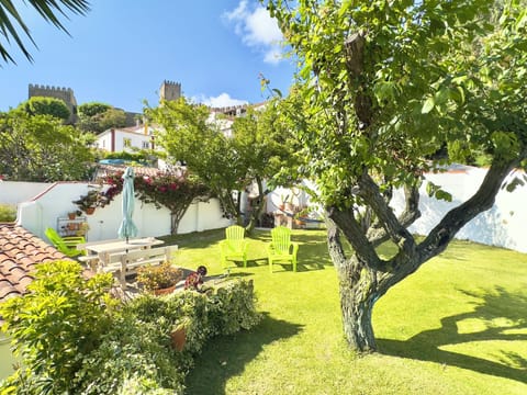 House garden panoramic view over the Óbidos castle and old city town.