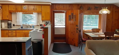 Inside from the living room toward the kitchen and dining area.