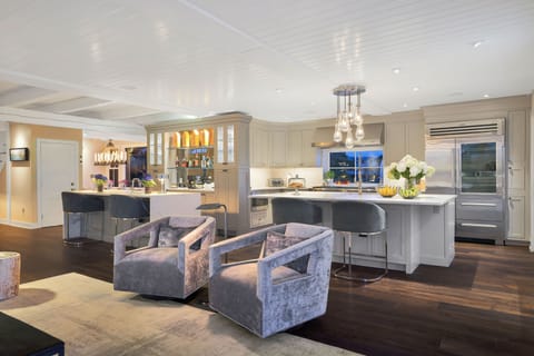 Lounge area with view to kitchen island and full bar