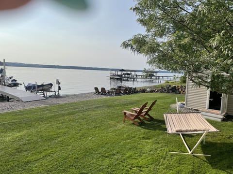 Lakefront with level beach and fire pit area