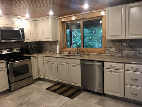 Sink side of kitchen w dishwasher