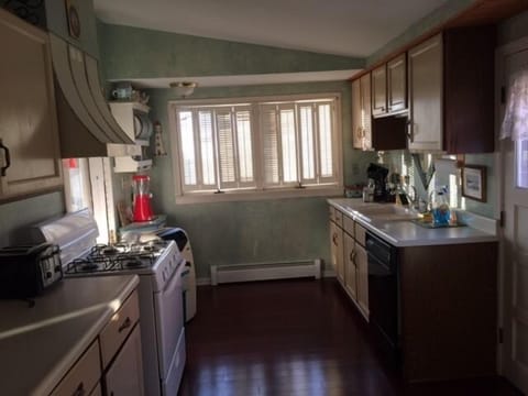 Overview of kitchen facing lake. Private two car parking to right.