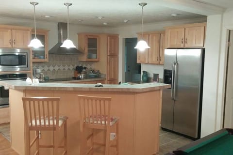 Kitchen Island Looking Toward Laundry Room and Pantry