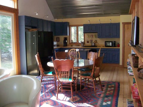 Dining table between kitchen and living area
