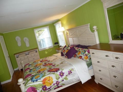 King bed in large and very cheery master bedroom