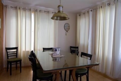 This Glass Covered Dining Room Table seats 8 for Dinner or a Card game or just some old fashioned Conversation.