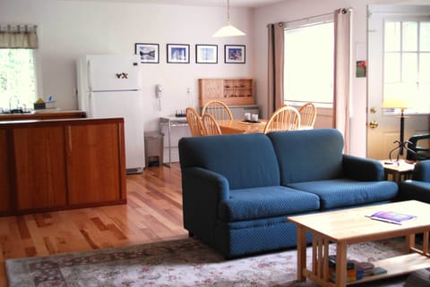 Living room, dining and Kitchen to the left. Teal color coach has been replaced.