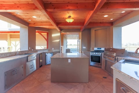 Bar Setup with Ice Maker.  Large Island for ease of meal prep.