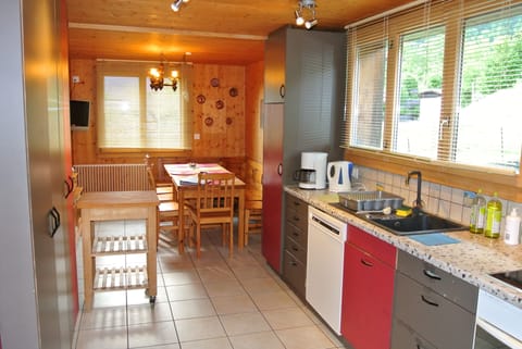 The kitchen of the 5-room  flat and its eating-area, suitable for big families.