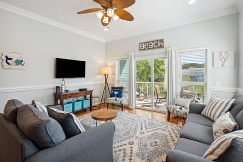 Living room with access to the screened in patio.