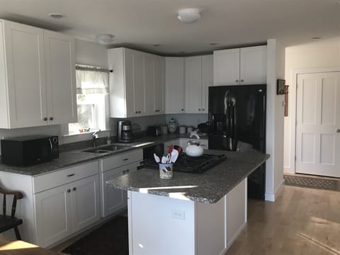 Kitchen with granite counters.
