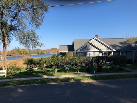 Southern elevation facing the street with South Bar Lake in the background.