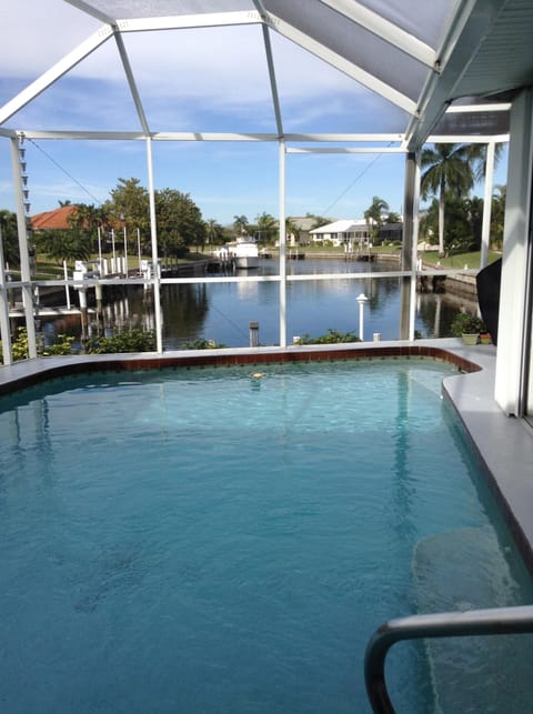 Heated pool, long view of canal and dock for fishing