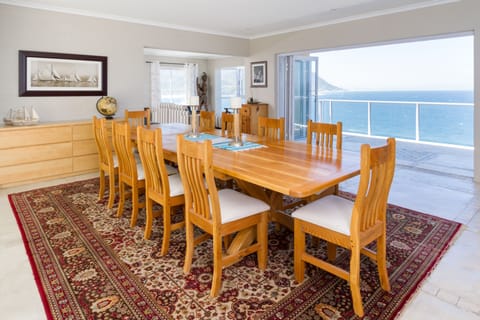 Spacious dining area opening onto a patio with breath taking views