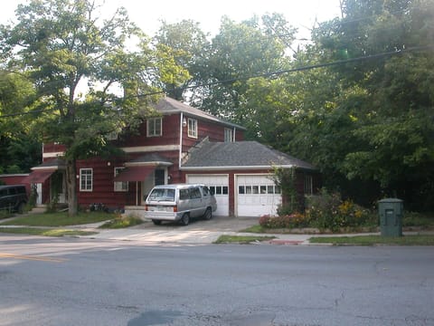 Park on driveway in front of right (south) garage.