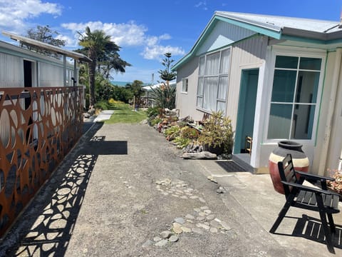 Main house on right, small studio left. Large studio close to sea is hosts home