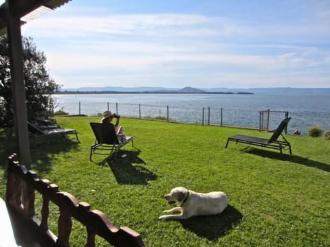 Rear ocean side fenced of yard.