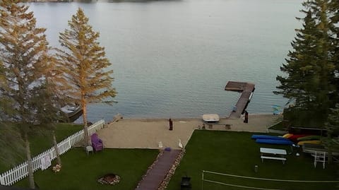 Aerial view of backyard with sandy beach