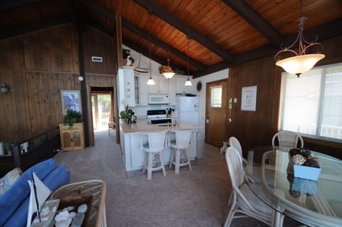 Looking at the kitchen and dining area from the water side doors