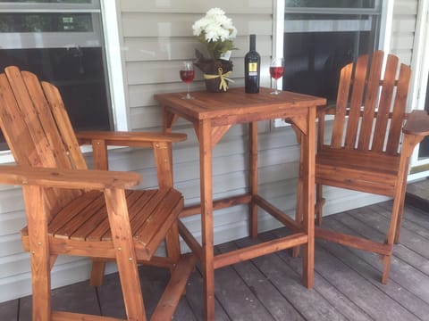 Sit on the front porch & relax while listening to nature & looking over the pond
