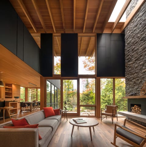 Be outdoors indoors: lake views + two-storey granite fireplace with skylight. 
