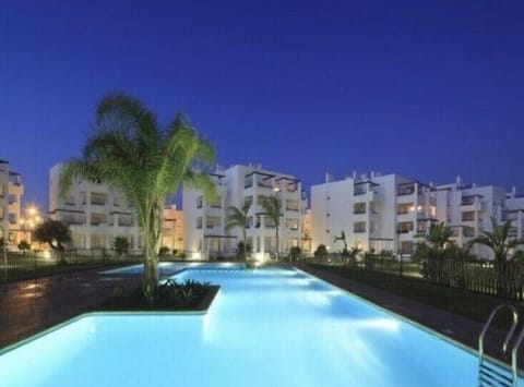 Penthouse apartment with a view of the pool at night!