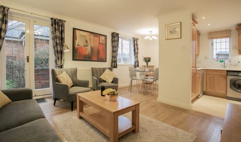 Open plan living area with dining room and kitchen in view.
