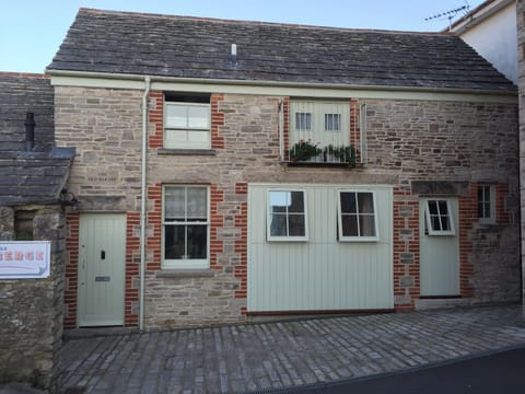Front aspect of The Old Bakery showing parking for 2 cars