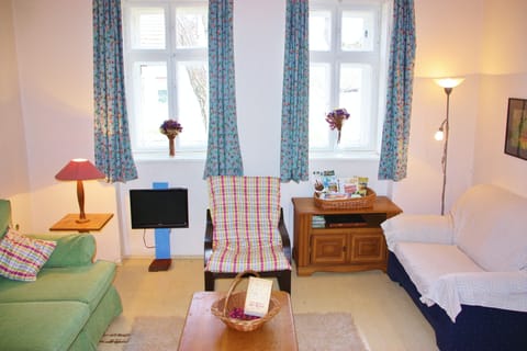 Second view of reception: double windows (with shutters) to front of house.