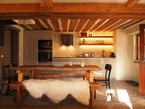 Kitchen with brand new appliances and dining area with handmade table