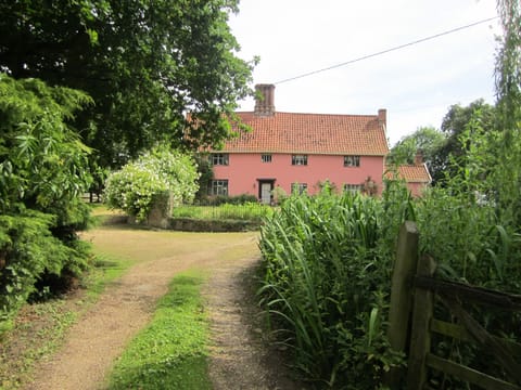 The Front of Abbey Farm with is long private drive.