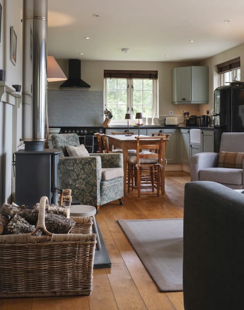 Cosy open plan Living room and kitchen. French doors looking out to the Loch.