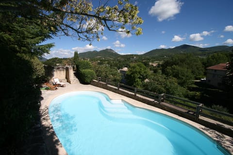 The pool in summer, with 900m hills in the background