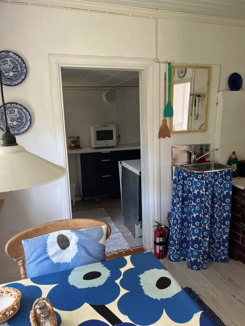 Kitchen into back kitchen which houses, fridge/freezer dishwasher stove & micro