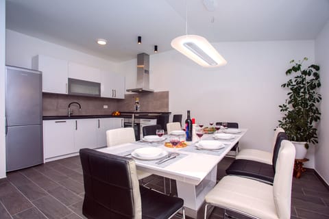 Dining area suitable for 8 people with new, fully equipped kitchen.