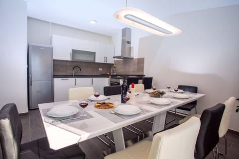 Dining area suitable for 8 people with new, fully equipped kitchen.