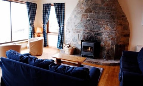Open plan sitting room. With log burner. 
