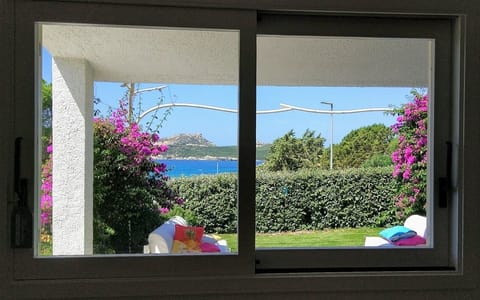 View of the ocean and garden from  the living room window and access to garden